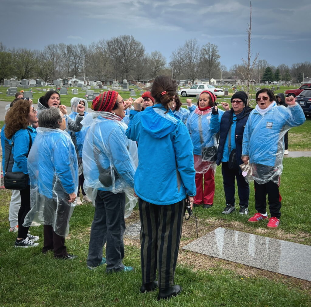 Lotinas sing in solidarity at the grave of Mary Harris “Mother” Jones