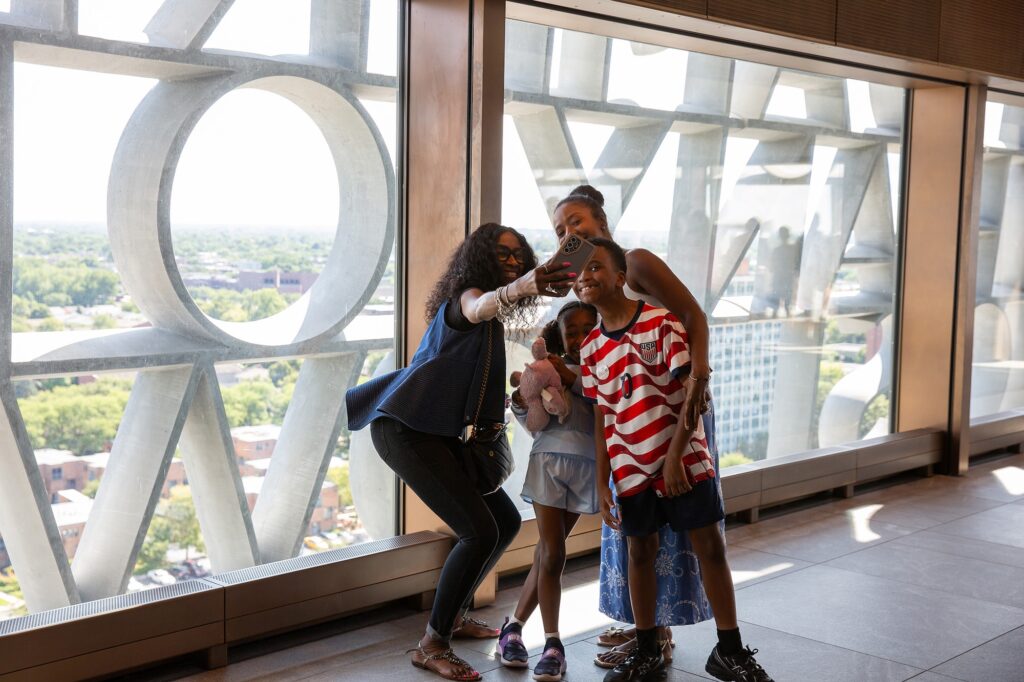 A family selfie at the lettering of the Obama Presidential Center. (Photo by Patti Gabriel)